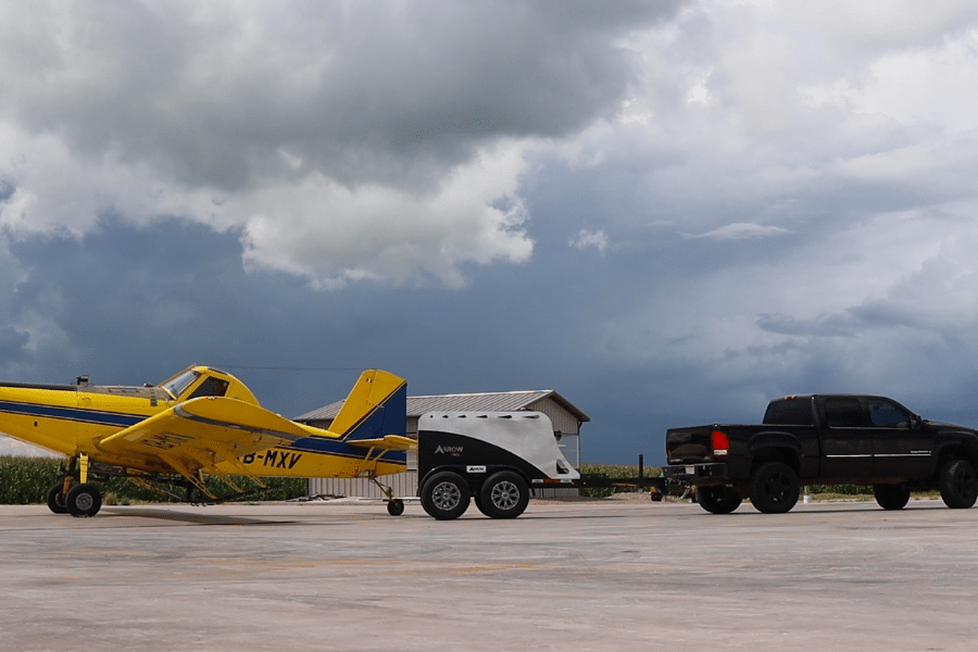 Arrow Trail trailer pulling an airplane