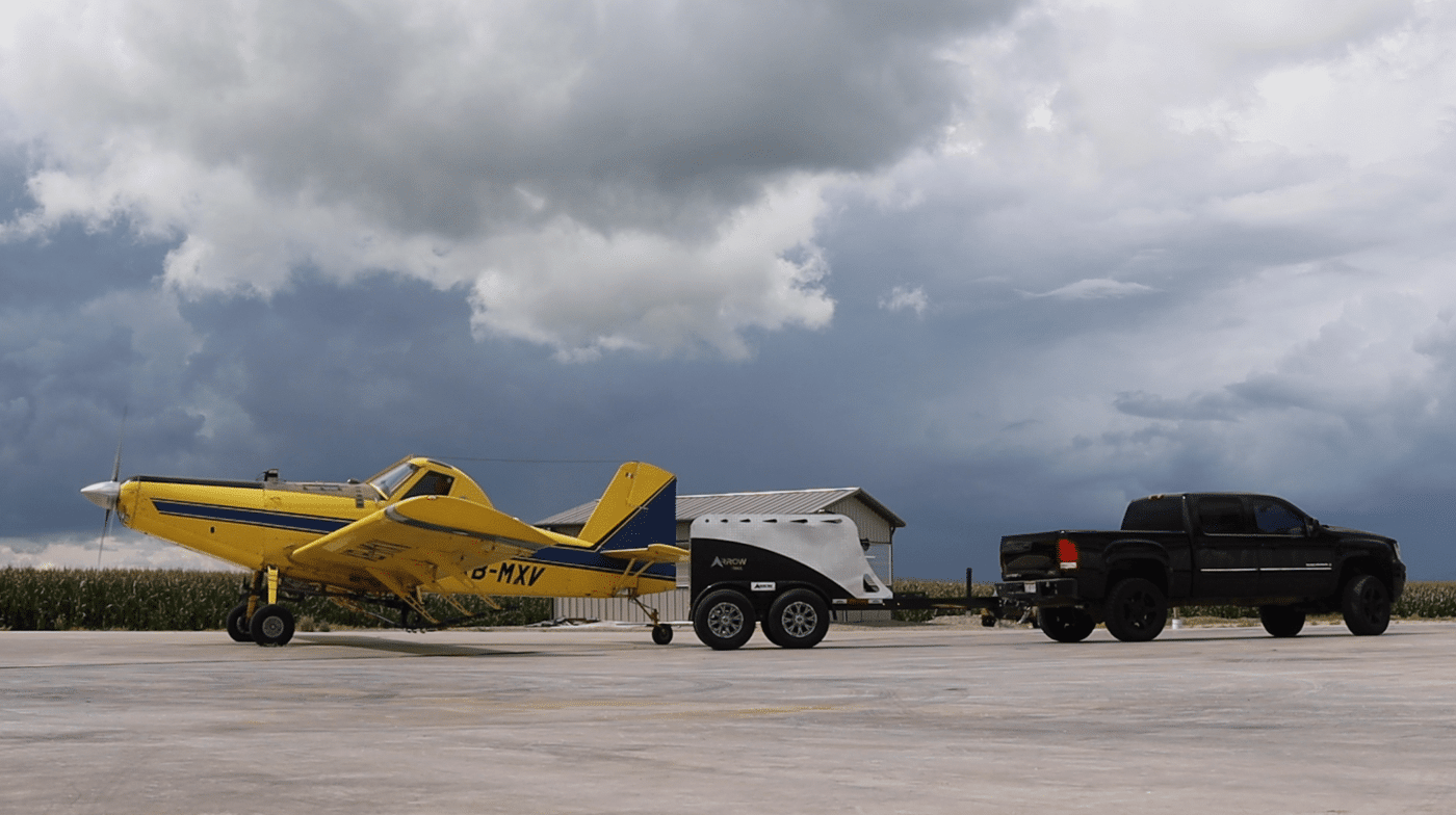 a trailer pulling a yellow plane in akron oh