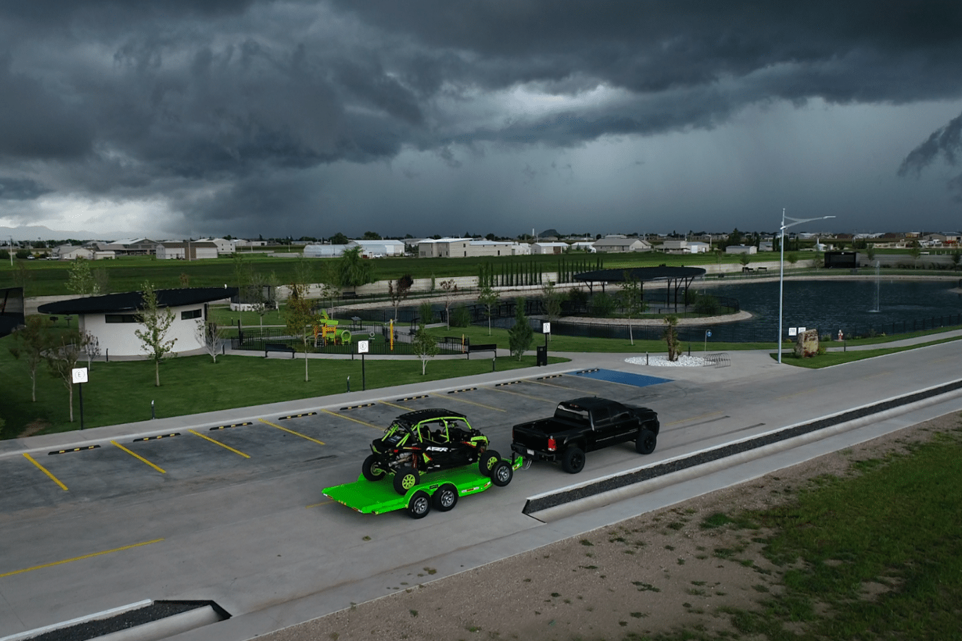 truck pulling green trailer with cart on it in memphis tn